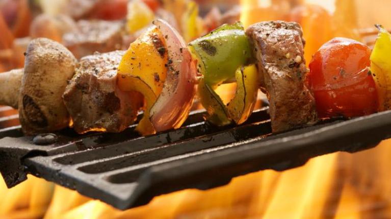 Vegetable-centric kebabs on an outdoor grill