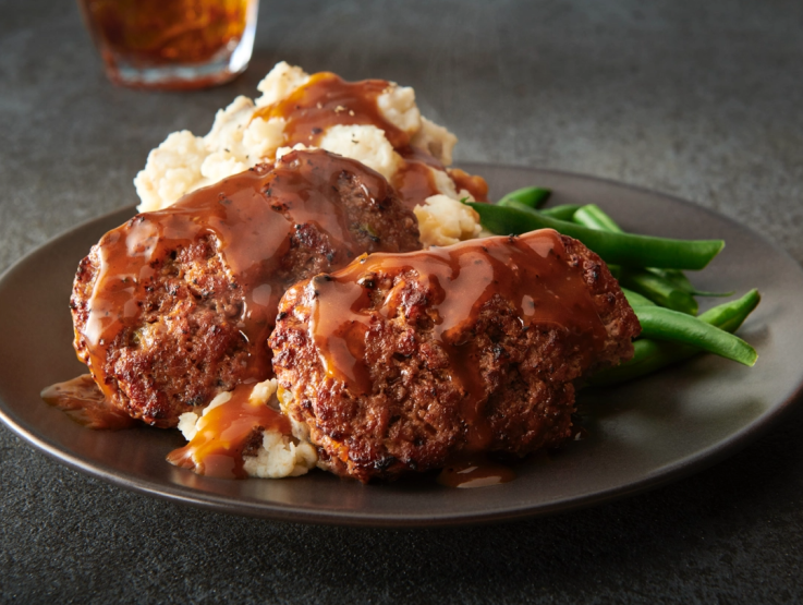 Meatloaf on a plate with mashed potatoes