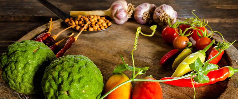 Flavorful condiments and spices on wooden platter