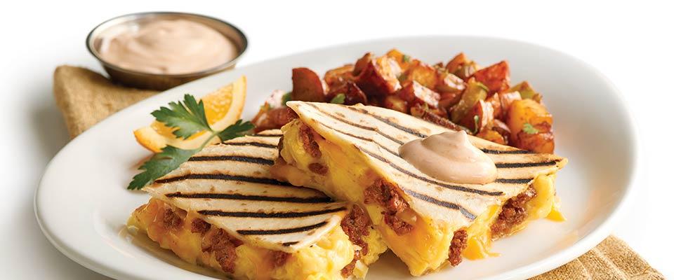 Plate of breakfast quesadillas with bacon