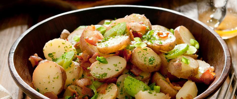 Wooden bowl with side of potato salad