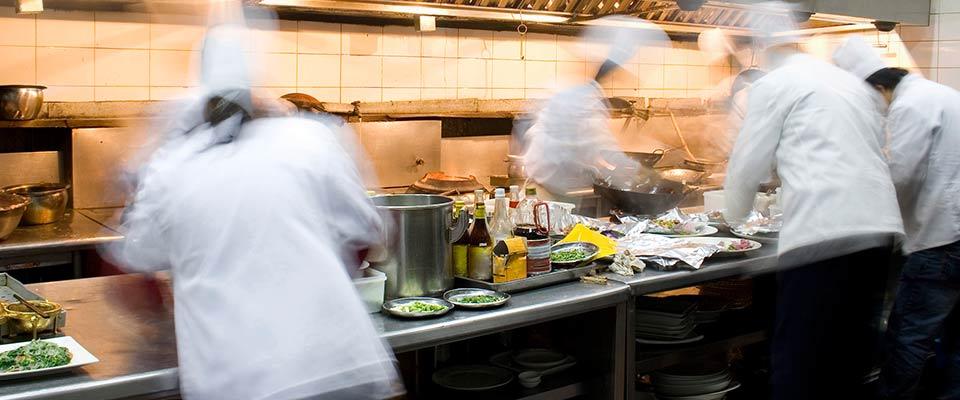 Cooks working in a busy kitchen