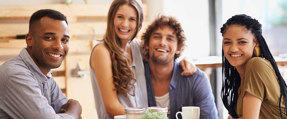 Group of millennials with beverages at cafe and restaurant