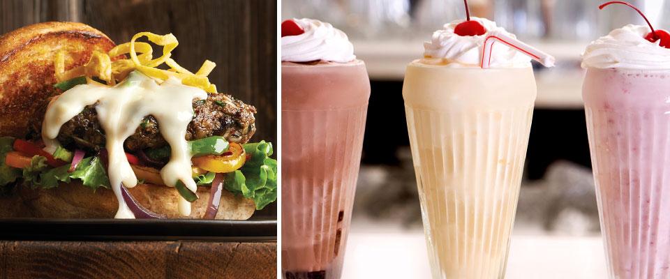 Signature cheeseburger; three shakes in glasses