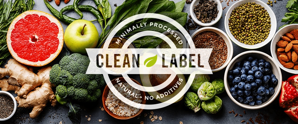 Clean Label badge over assortment of minimally processed foods