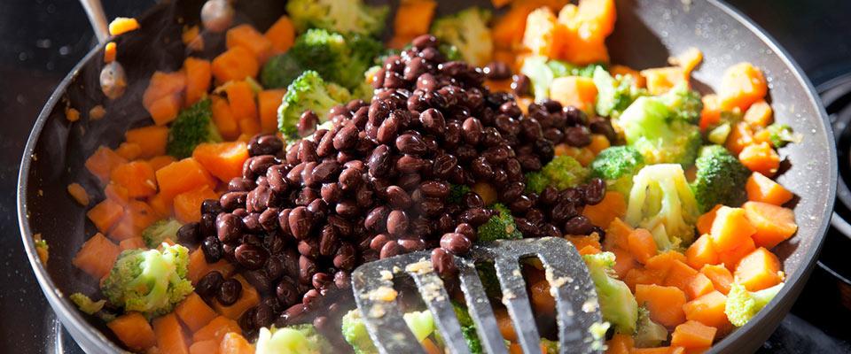 Pan of black beans, sweet potatoes, and broccoli