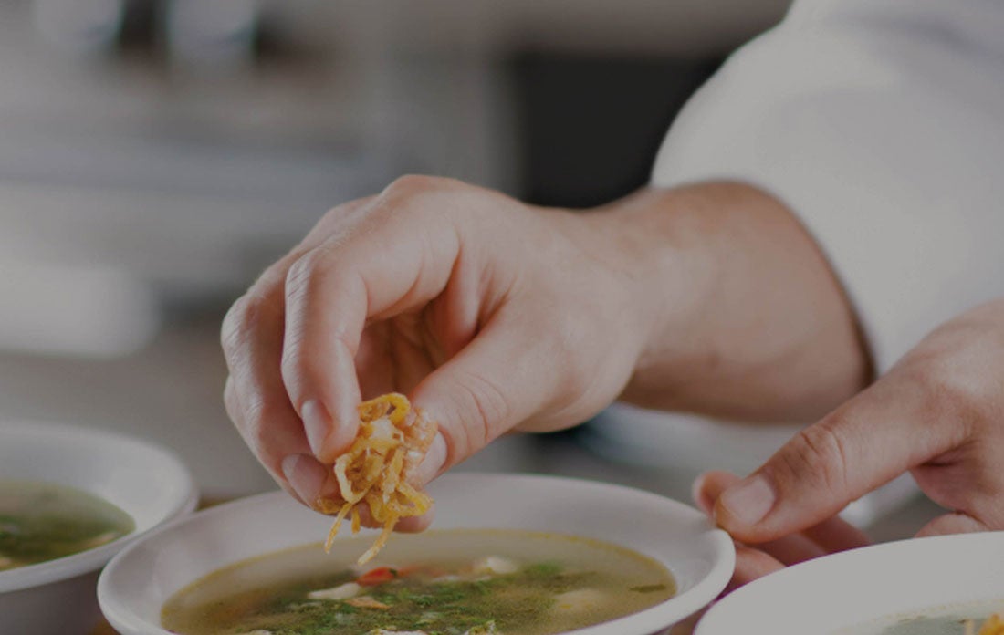 chef garnishing a plate