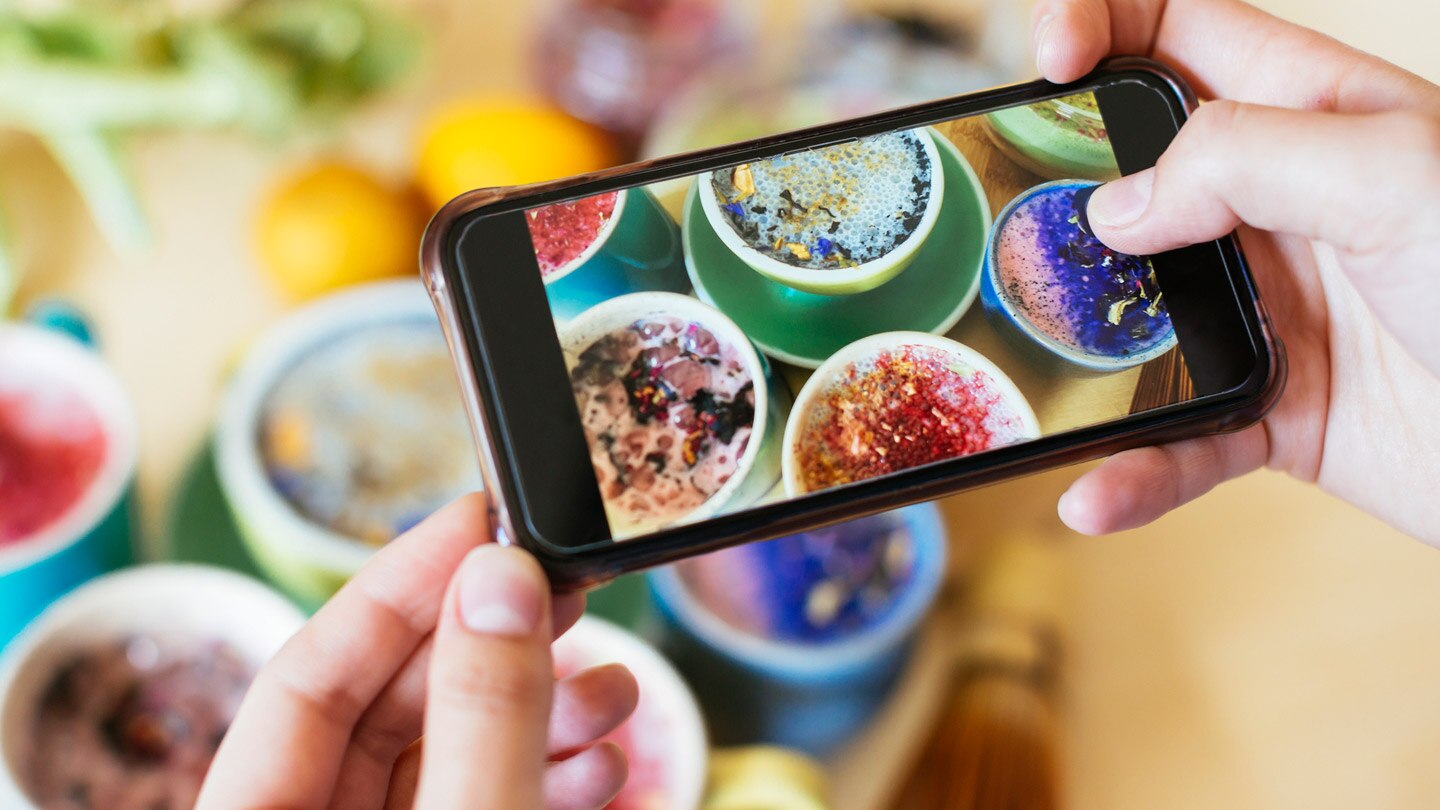 Cell Phone taking picture of food