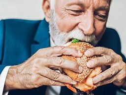 2023 Trend Report Man Biting into Sandwich