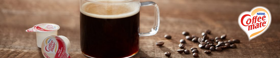 Mug of coffee with coffee mate creamers