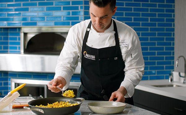 Chef Logan plating food