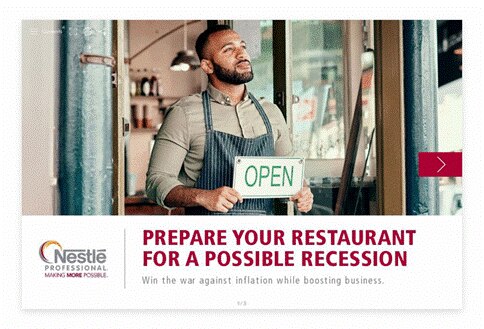 Man in apron holding a sign that says, &quot;Open.&quot;