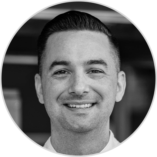 A black and white profile photo of Chef Logan McCoy from Nestle Professional smiling