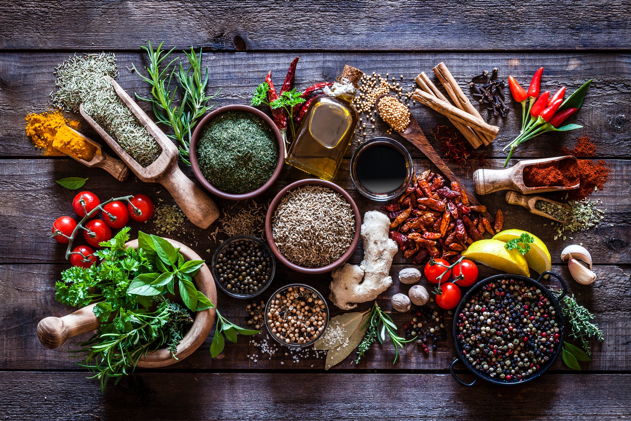 thirty colorful spices on a table