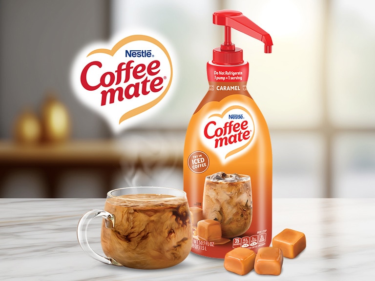 coffee mate caramel pump bottle with hot coffee in clear cup
