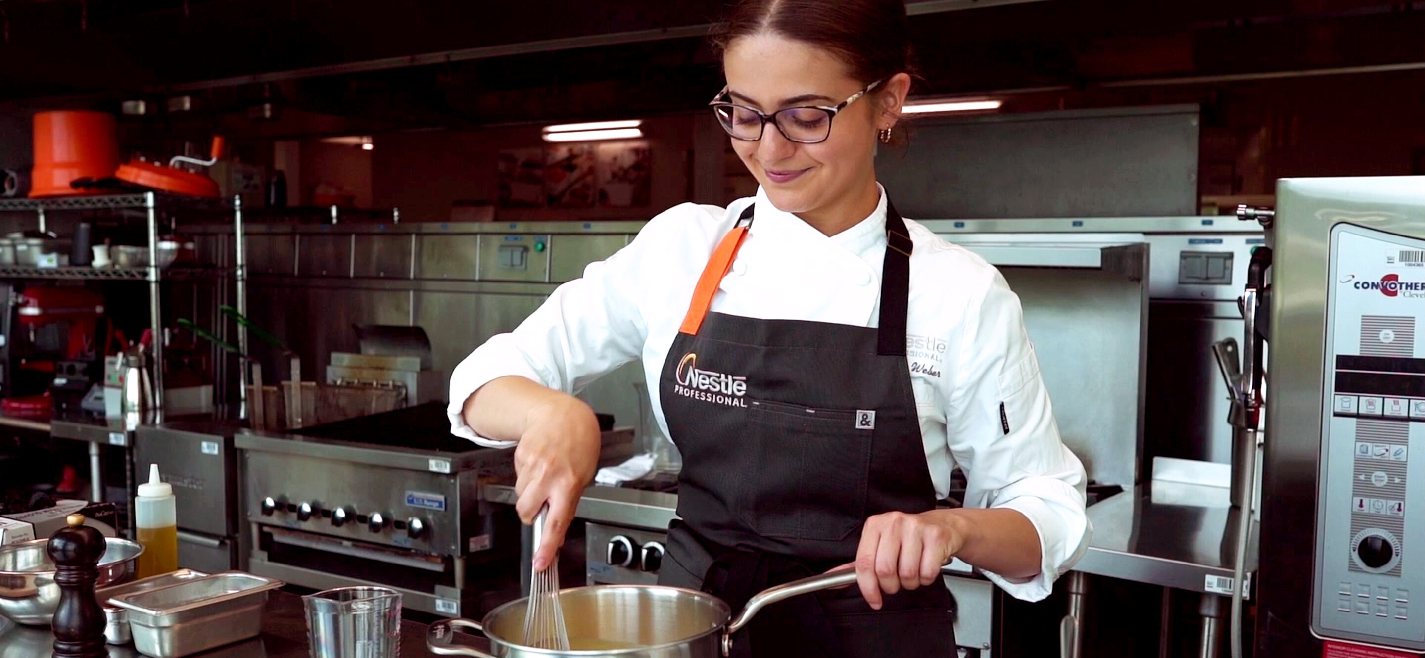 Chef Jordan stirring a pot on the stove