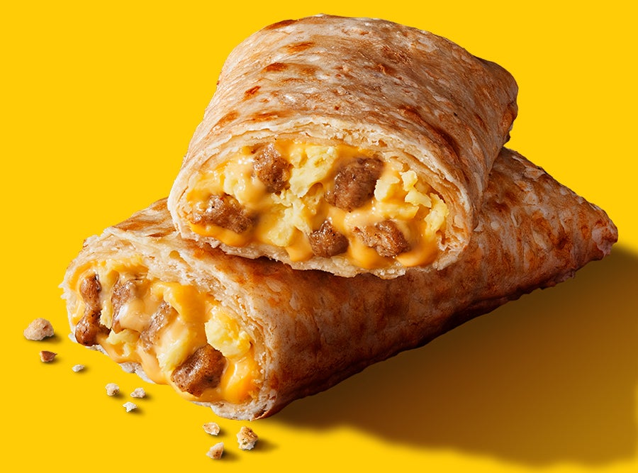 A delicious Hot Pockets breakfast sandwich with melted cheese and savory sausage on a yellow background