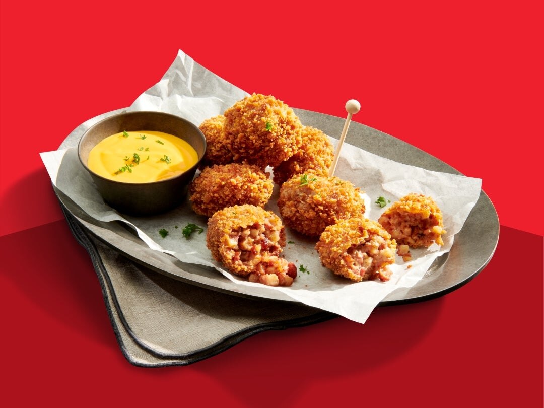 filled fried appetizer with cheese sauce