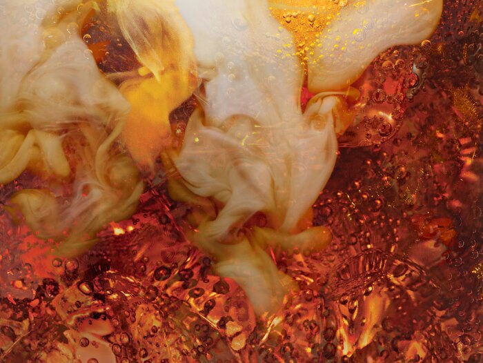 A close-up of a glass of soft drinks, showcasing its vibrant color and refreshing appeal