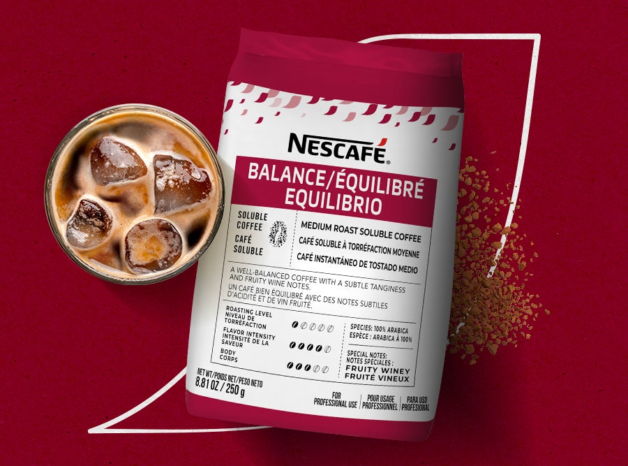 xt Nescafé Balance Medium Roast Soluble  Coffee bag and a glass of iced coffee. A  well-balanced coffee with fruity and winey
