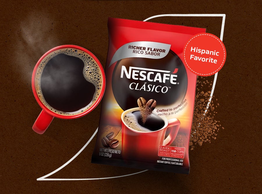 Steaming mug of Nescafé Clásico instant coffee, a Hispanic favorite, with product packaging. Richer flavor
