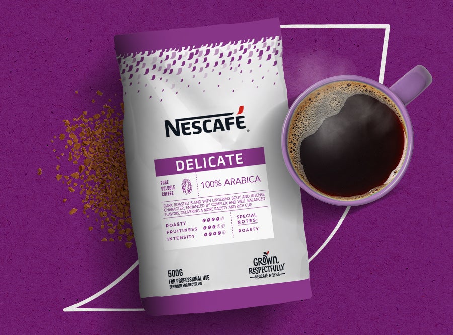 t Nescafé Delicate 100% Arabica coffee bag  and a mug of freshly brewed coffee. Grown  respectfully for a delicate flavor
