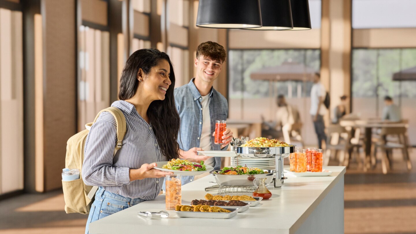 woman and man getting food at counter