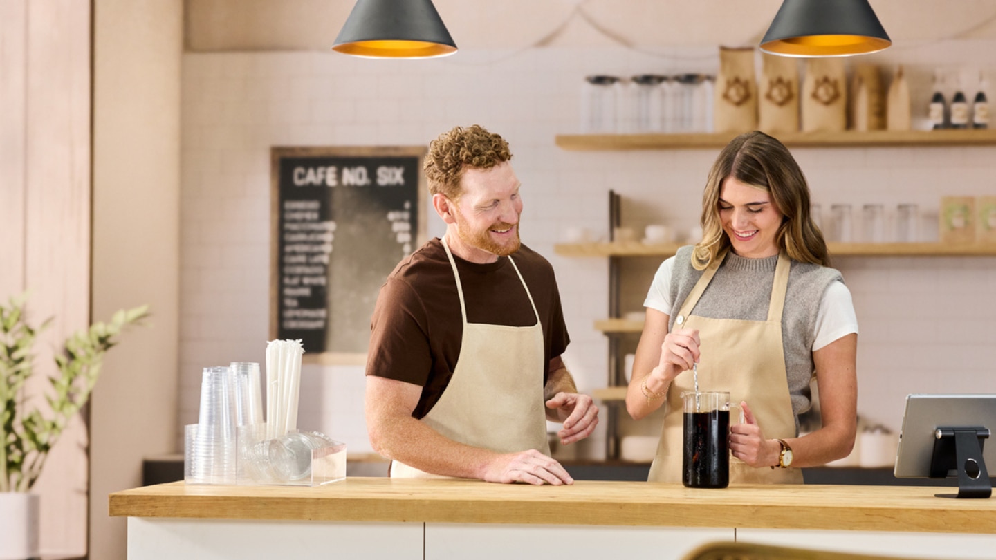 two people in a kitchen
