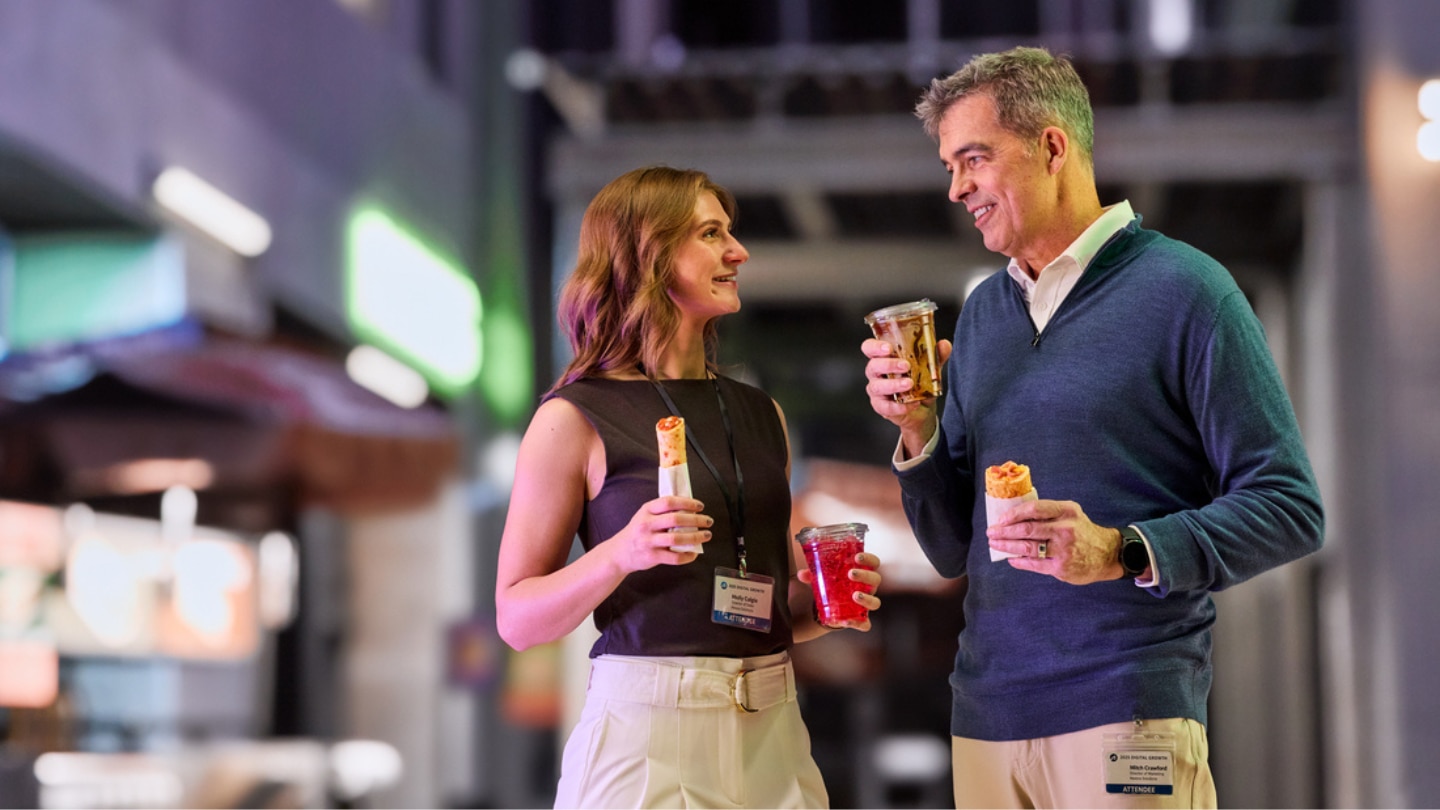 man and woman holding grab and go foods