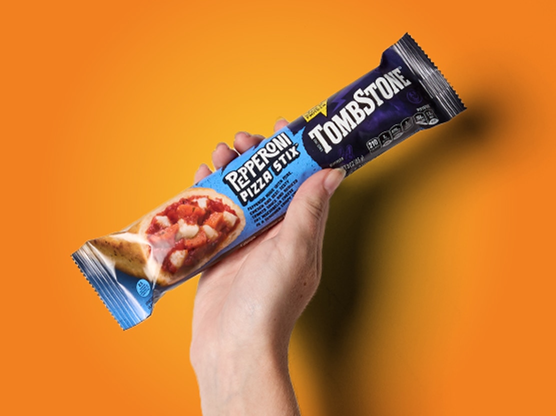 hand holding Tombstone pizza stix