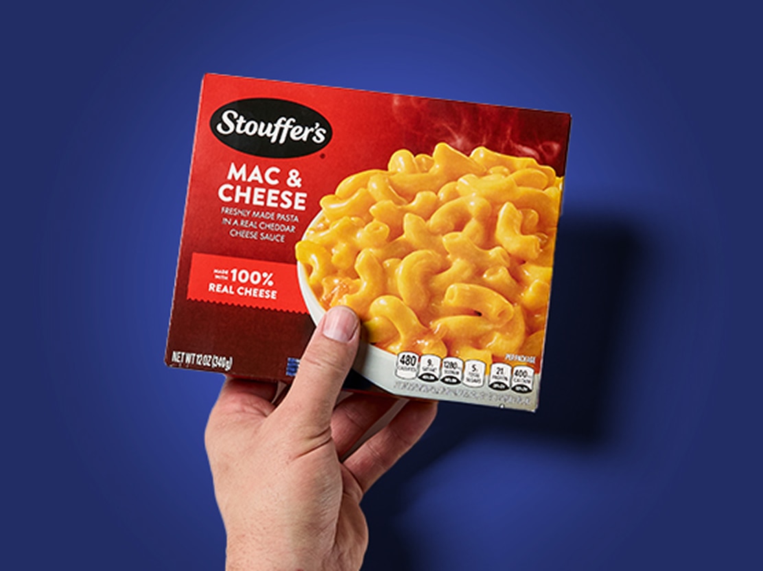 Hand holding Stouffer frozen meal