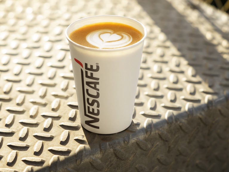 nescafe coffee in paper cup
