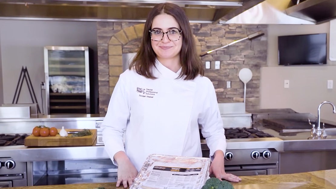 Chef with tray of Stouffer's Vegetable Lasagna