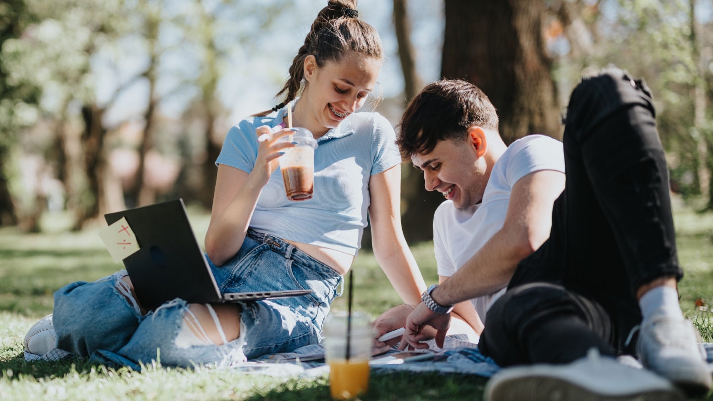 man and woman outside drinking cold juice