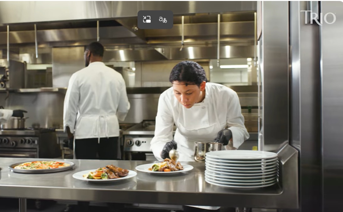 two chefs working in kitchen