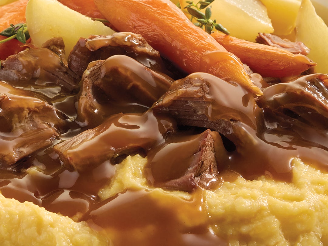 shredded beef with gravy and carrots