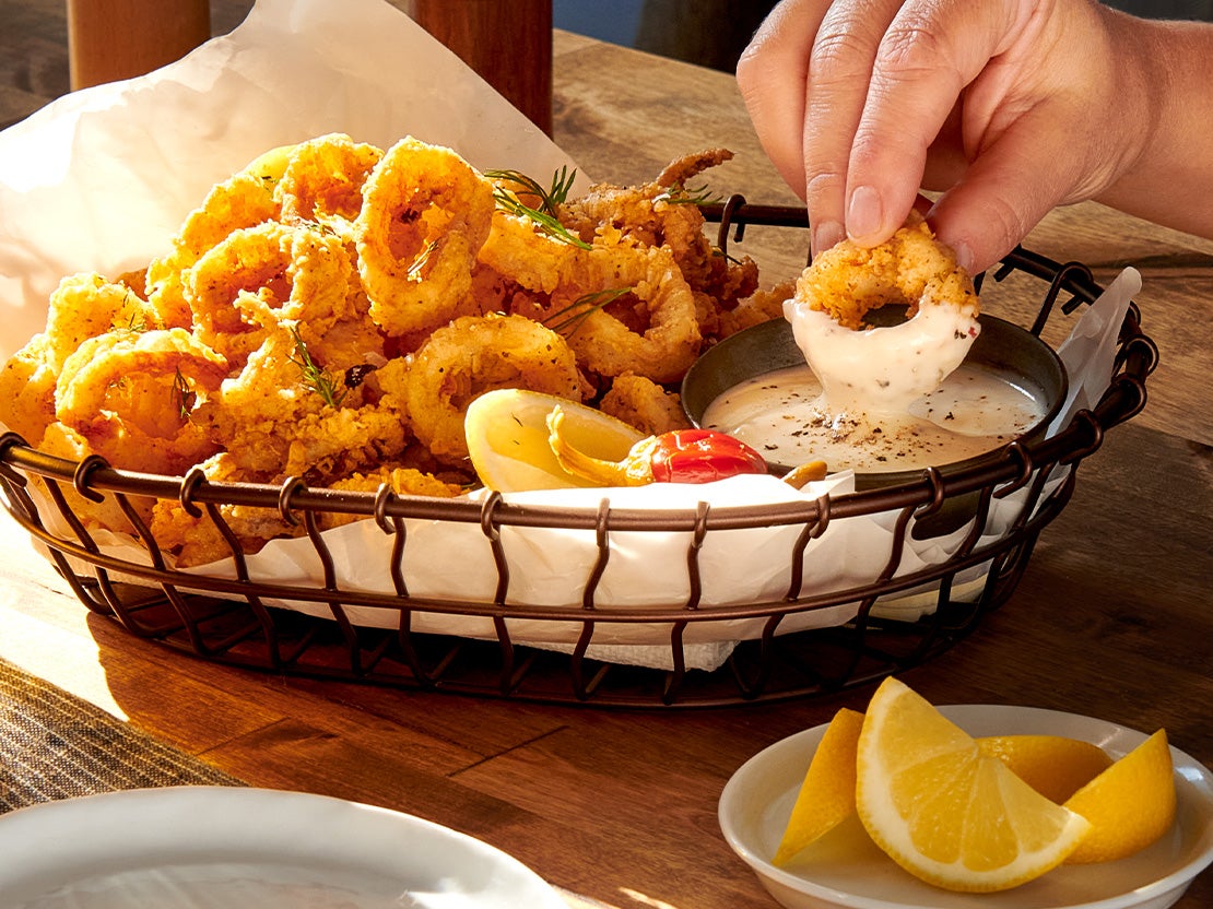 A basket of calamari rings and dip