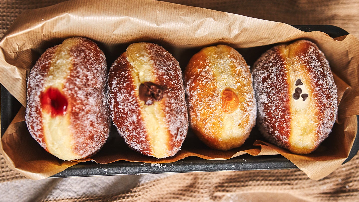 Four assorted jelly and creme-filled donuts