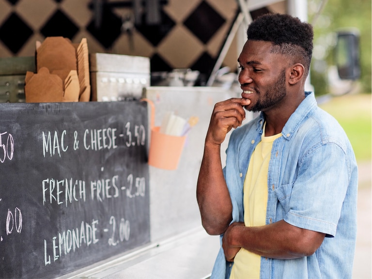 man reviewing menu options