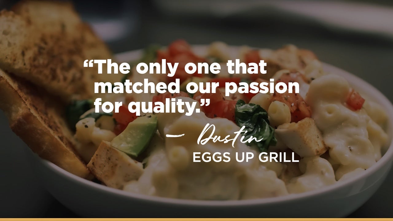 A mac and cheese dish with text overlay that says,The only one that matched our passion for quality.- Dustin at Eggs Up Grill