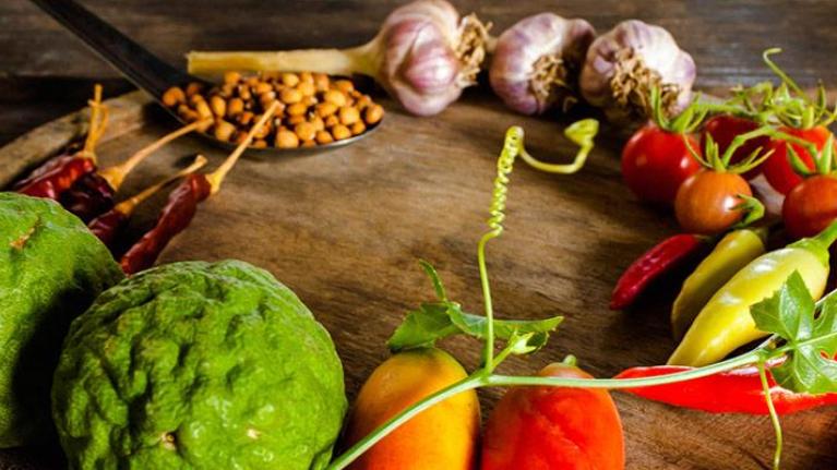 Flavorful condiments and spices on wooden platter