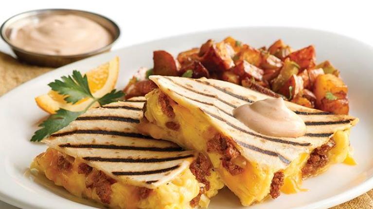 Plate of breakfast quesadillas with bacon