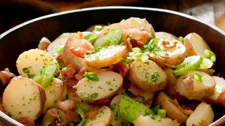 Wooden bowl with side of potato salad