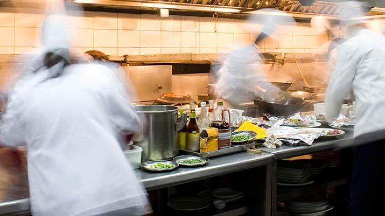Cooks working in a busy kitchen