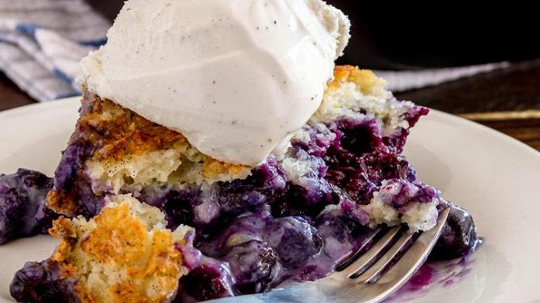 Plate of blueberry cobbler with ice cream