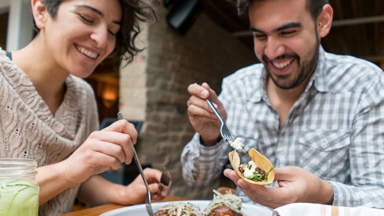 Two people sharing a meal at a restaurant