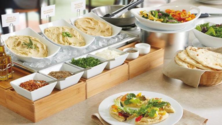 Wellness-focused action station with naan and hummus