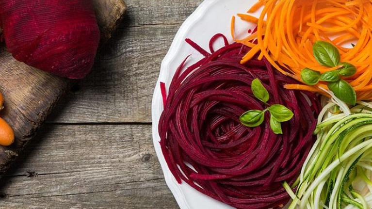 Plate of spiralized vegetables made from carrot, zucchini, and beetroot