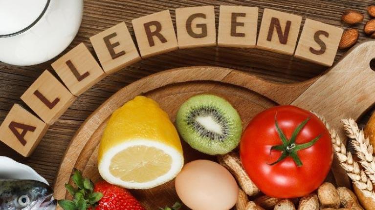 Assorted food allergens on wooden table