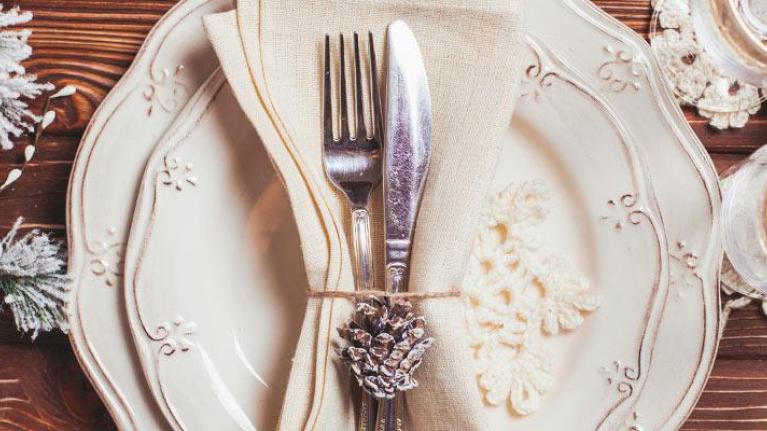 Holiday plate setting on wooden tabletop